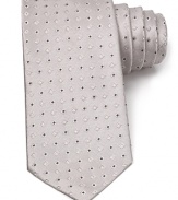 An opulent tie in lavish Italian silk features an allover diamond design in a classic width.