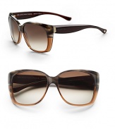 Oversized acetate frames in a modern cat's-eye shape with logo detail written on temple. Available in black with grey shaded lens or brown horn olive with brown gradient lens.100% UV protection Made in Italy 