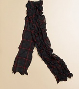 A classic tartan plaid gives a heritage look to a ruffled scarf, perfect for the holiday season.Multi-tiered layered rufflesRectangular shaped55 X 5CottonMachine washImported