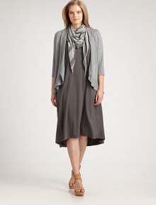 A unique oval silhouette lends a flattering, feminine drape to this soft knit style.Open front with shawl collarThree-quarter sleevesAsymmetrical hemlineRib-knit cuffs and edgesAbout 25 from shoulder to hem90% viscose/7% nylon/3% spandexDry cleanImported of Italian fabric