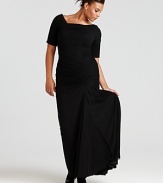 The off-shoulder cut of this Tadashi Shoji gown lends a suggestive tone to the beautifully timeless style.