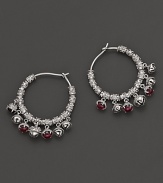 Inspired by Zen philosophy, these hoop earrings from Paul Morelli feature intricately detailed sterling silver meditation bells, set with pink rhodolite cabochons.