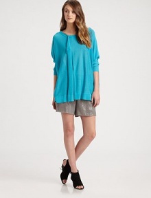 This luxuriously oversized knit drapes in a featherweight pullover styled with a soft front ruffle.BoatneckDropped shouldersLong sleevesAbout 27 from shoulder to hem52% cotton/48% rayonDry cleanImportedModel shown is 5'10 (177cm) wearing US size XS/S. This luxuriously oversized knit drapes in a featherweight pullover styled with a soft front ruffle.BoatneckDropped shouldersLong sleevesAbout 27 from shoulder to hem52% cotton/48% rayonDry cleanImportedModel shown is 5'10 (177cm) wearing US size XS/S.