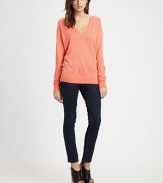 With a relaxed fit and a deep v-neck, this cozy sweater is both comfy and sexy.V-neckLong sleevesRibbed collar, cuffs and hemExtra fine merino woolDry cleanImported of Italian fabric