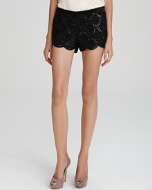 Echo vintage-inspired decadence in a modern silhouette with these Basix sequin shorts, touting a demure scalloped hem.