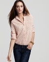 Fashioned in delicate eyelet, this Sam & Lavi shirt is a feminine take on the classic button up.