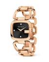 A Gucci bracelet watch with rose gold-tone links makes a luxe presentation with a sleek black face.