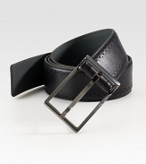 Sleek wardrobe essential handsomely crafted in genuine calfskin leather with perforated detail.LeatherAbout 1¼ wideImported