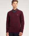 A practical pullover sweater with collegiate-inspired style effortlessly shaped in a warm blend of merino wool and cotton.V-neckRibbed knit collar, sleeves and hem54% merino wool/46% cottonDry cleanImported