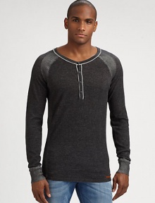 A classic henley sweater gets a contemporary feel in cozy, cotton accented by striped shoulder detail.CrewneckFour-button placketCottonMachine washImported