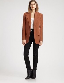 The single-breasted blazer, impeccably tailored in an oversized silhouette that boasts defined shoulders and a nipped waist.Notch collarWelt pocketsBodice dartsSingle button closureHip flap pocketsDouble back ventsAbout 29 from shoulder to hemCottonDry cleanImportedModel shown is 5'10 (177cm) wearing US size 4.