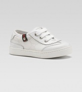 The famous fabric in a subtle GG jacquard, trimmed with rich leather and a striped, webbed flag accent at the edge.GG fabric upperLeather toe, tongue and back accentsThree-grommet lace-up frontG button detailRubber soleMade in Italy