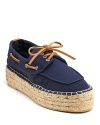 Pair Tory Burch's trend-right flatform espadrilles with a crisp, flowing dress for a look that's supremely summer.