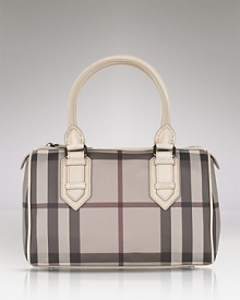 Burberry's signature check lends luxe style to the classic bowling bag silhouette. Burberry's signature check lends luxe style to the classic bowling bag silhouette.