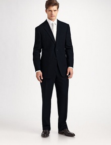 The essential black suit, timeless and elegant in 100% wool crepe. Made in Italy. Dry clean.JACKETTwo button silhouette with notch lapel Chest welt pocket Besom pockets Button cuffs Side vents Fully lined About 30 from shoulder to hemPANTSFlat front, belt loops Zip fly Lined to knee Quarter top pockets Side pockets Button back welt pockets Unfinished hemPlease note: Alterations are available at all Saks Fifth Avenue stores. 