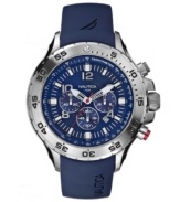 Blissful blue with chronograph functionality. This Nautica watch features a blue resin strap and round stainless steel case. Bezel etched with numerals. Blue dial with logo, stick indices and numerals, three subdials and date window. Quartz movement. Water resistant to 100 meters. Five-year limited warranty.