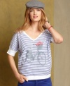 Tres chic! Tommy Hilfiger's cotton tee features a cute bicycle graphic and bright stripes that instantly recall Parisian cool.