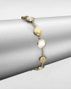 From the Jaipur Resort Collection. Discs of hand-engraved, brushstroke-textured 18k gold alternate with buttons of lustrous mother-of-pearl along a delicate gold chain.Mother-of-pearl18k yellow goldLength, about 7Lobster claspMade in Italy