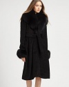 Lush, textured faux fur styled with an oversized shawl collar is the epitome of vintage-inspired luxury.Shawl collarBodice dartsSelf-beltAbout 39 from shoulder to hem65% viscose/35% cottonDry cleanImportedModel shown is 5'10 (177cm) wearing US size Small.This style runs true to size. We recommend ordering your usual size for a standard fit. 