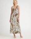 Exotic leopard-print falls to the floor in this beguiling v-neck design.Wide shoulder straps Gathered bodice Empire waist About 52 from shoulder to hem Polyester; machine wash Imported