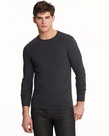 Long sleeve crewneck with wide cuff bands. Slimmer fitting with logo embroidered at bottom hem. Long sleeve crewneck with wide cuff bands. Slimmer fitting with logo embroidered at bottom hem.