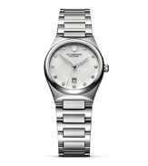 A poised timepiece from Victorinox Swiss Army features a luminous wristband and geometric-inspired diamond markers.