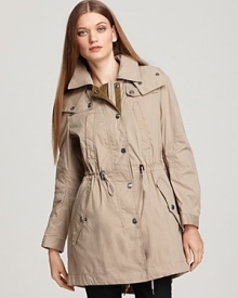 Featuring a detachable interior vest, this versatile Burberry Brit anorak is presented in a classic color and a timeless silhouette.