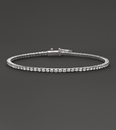 Glittering diamonds flow over 18K white gold.