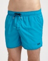 Stylish swim trunks are both sporty and functional, rendered in quick-drying nylon.Elastic drawstring waistSide slash, back flap pocketsInseam, about 4PolyamideMachine washImported