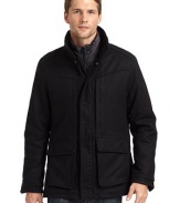 THE LOOKStand collarZip front with snap storm flapDrawcord waistSnap flap pocketsSnap cuffsRemovable down vestTHE FITAbout 27 from shoulder to hemTHE MATERIALOuter shell: 80% wool/20% cashmereOuter fill: polyesterInner shell: polyesterInner fill: 80/20 duck downFully linedCARE & ORIGINDry clean Imported
