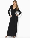 Slinky matte jersey creates an elegant drape on this long-sleeved dress, ornamented with a crystal-studded bar pin at the hip for sweeping old-Hollywood glamour.