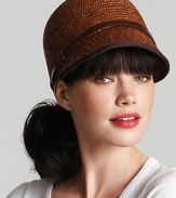 An equestrian style straw cap with pretty brown leather trim and buckle detail at side.