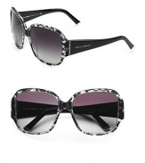 A feminine design inlayed with real Dolce & Gabbana lace on the front frame and solid temples. Available in black with grey gradient lens.Acetate frame with crystal lens UV 400 lens 100% UV protective Made in Italy