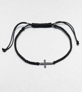 From the Zasha Collection. A plaited design that features a rich black diamond accented 14k white gold cross. Silk cordBlack diamonds, .06 tcw14k white goldLength, about 7Knotted closureImported 