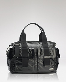 Shiny and chic, this duffle bag hides a practical secret: it's packed with on-the-go essentials for stylish mamas. By storsak. Shiny and chic, this duffle bag hides a practical secret: it's packed with on-the-go essentials for stylish mamas. By storsak.