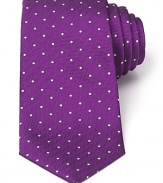 A brilliant design, from the strikingly rich color to the ingenious and unique craftsmanship of Turnbull & Asser, this classic tie features a polka dot pattern with a herringbone ground for a dynamic accent to your dress shirting.