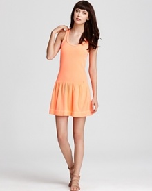 Sport this season's new athletic look in this Juicy Couture tank dress. A drop waist and ruffled skirt lend feminine appeal to the classic silhouette. Sport this season's new athletic look in this Juicy Couture tank dress. A drop waist and ruffled skirt lend feminine appeal to the classic silhouette.