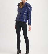 This sporty, metallic puffer style boasts a detachable hood for extra warmth.Detachable snap-front drawstring hood Front zip Flap patch pocket on arm Side slash zipper pockets Adjustable snap cuffs Fully lined Nylon Machine wash Imported