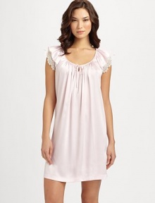 Liquid, silky-smooth fabric in a soft hue is accented with lady-like lace sleeves. Scoopneck with small keyhole and self-tie bowFront shirring for added drapeShort butterfly sleeves with semi-sheer lace layerAbout 36 from shoulder to hemPolyesterMachine washImported Liquid, silky-smooth fabric in a soft hue is accented with lady-like lace sleeves. Scoopneck with small keyhole and self-tie bowFront shirring for added drapeShort butterfly sleeves with semi-sheer lace layerAbout 36 from shoulder to hemPolyesterMachine washImported