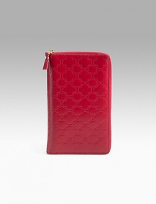 Clover-embossed leather zip-around wallet has plenty of interior sections to keep your essentials at hand. Opens to reveal 11 credit card slots, four deep pockets, ID window, pen holder and a coin pocket with snap closure. Zip-around closure Leather lining 5W X 9H X ¾D Made in Spain Clover-embossed leather zip-around wallet has plenty of interior sections to keep your essentials at hand. Opens to reveal 11 credit card slots, four deep pockets, ID window, pen holder and a coin pocket with snap closure. Zip-around closure Leather lining 5W X 9H X ¾D Made in Spain