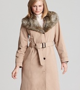 This Calvin Klein trench coat gets a glamorous update with a faux fur neckline--a luxe twist on the perennial favorite.