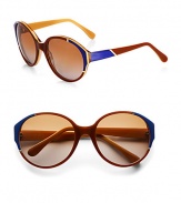 Oversized acetate frames with elegant, colorblocked detail and shiny metal trim accent these celeb-worthy shades. Available in brown/honey/blue and light gold metal with brown lens or smoke/cream and light gold metal with grey lens.Plastic temples100% UV protectionMade in Italy 
