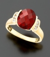 Bold and beautiful. An oval-cut garnet (3-1/2 ct. t.w.) held dear to her heart with round-cut diamonds (1/8 ct. t.w.) at the sides, all set in 14k gold.