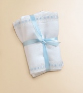 Soft cotton burp pads, decorated with cute blue dot trim.Includes two padsMachine washCottonImported