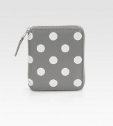 A classic contrast of painted polka dots on luxe leather with a zip around closure. Top zip closure One inside snap pocket One inside bill slot Four credit card slots Leather lining 4W X 5H X 1D Imported