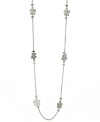 Fashionably floral. GUESS's trendy long necklace can be layered with any look and features petite flower-shaped stations. Crafted in silver tone mixed metal with sparkling crystal accents. Approximate length: 38 inches + 2-inch extender.