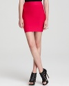 Hot color and subtle seaming detail balance each other on this so-slim knitted skirt.