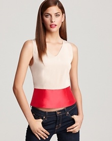 The combination of vibrant color blocking and a unique flared silhouette gives this MARC BY MARC JACOBS top standout style status. A definitively feminine silhouette, this look also features concealed snaps through the side.