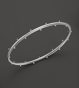 Sterling silver buds blossom on this Elizabeth Showers bangle.