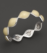 Warm vanilla enamel drops over a carved sterling silver bangle By Elizabeth Showers.